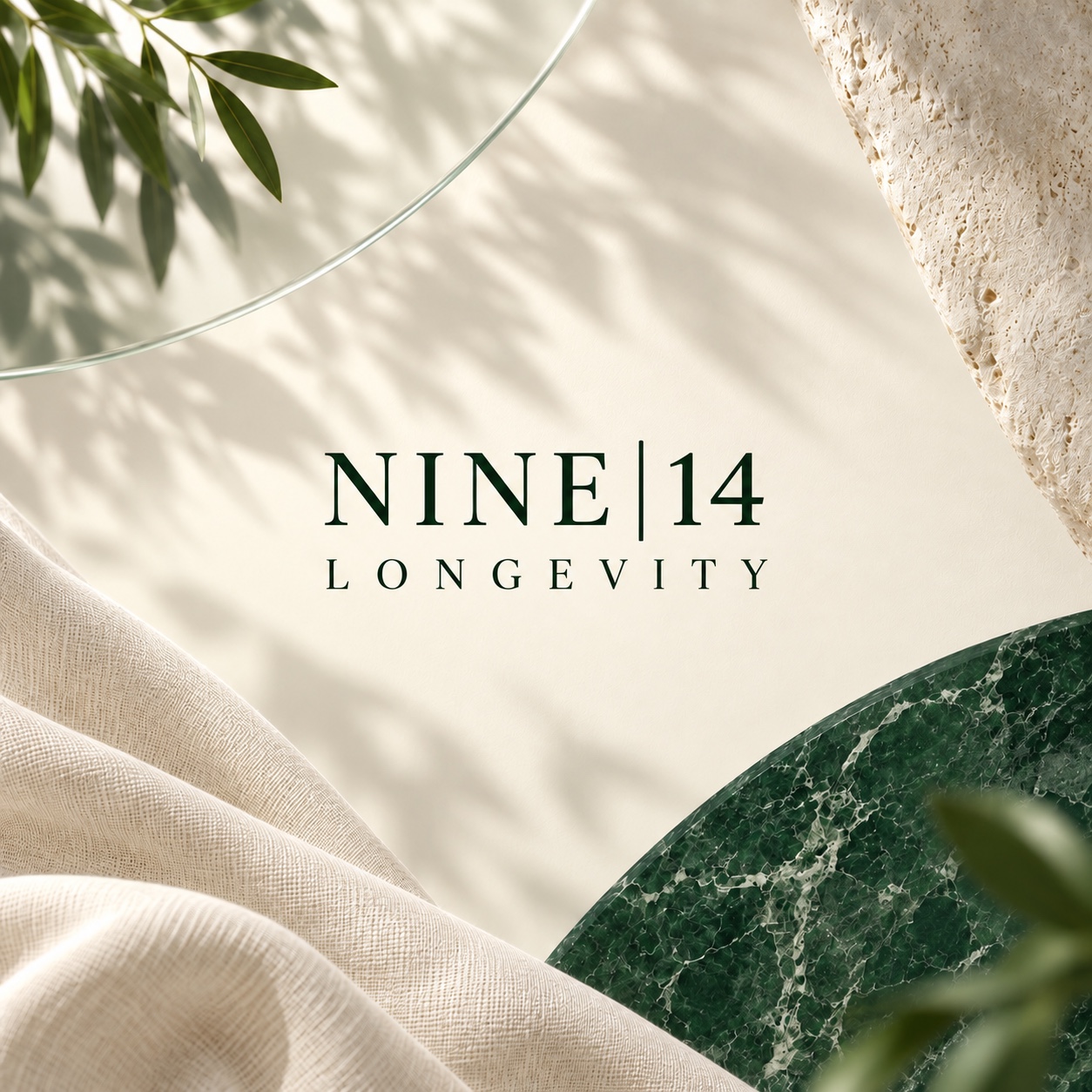 Official Nine|14 Longevity wordmark set against fine linen, natural stone and deep green marble